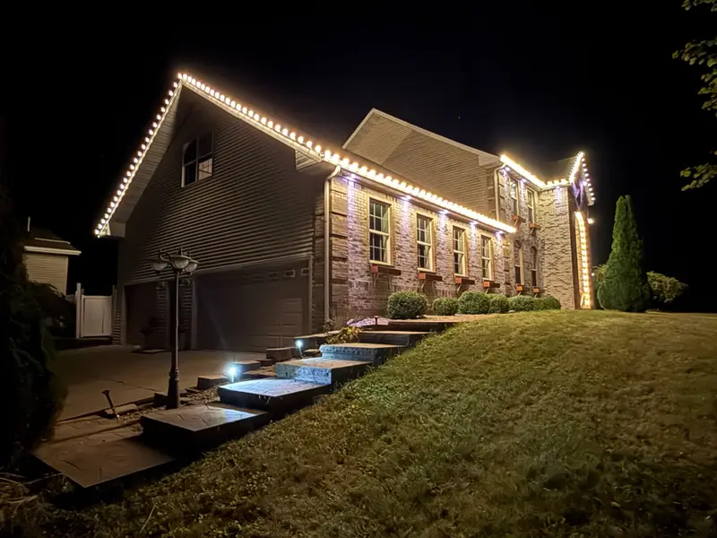 Clean warm white professional light installation across a large building front